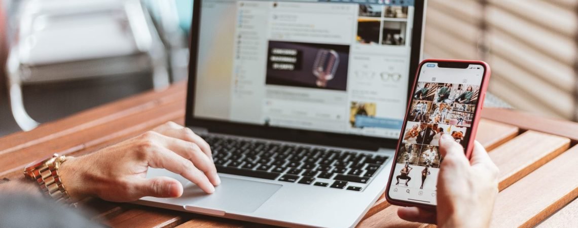 person-holding-red-iphone-x-and-macbook-pro-2764670